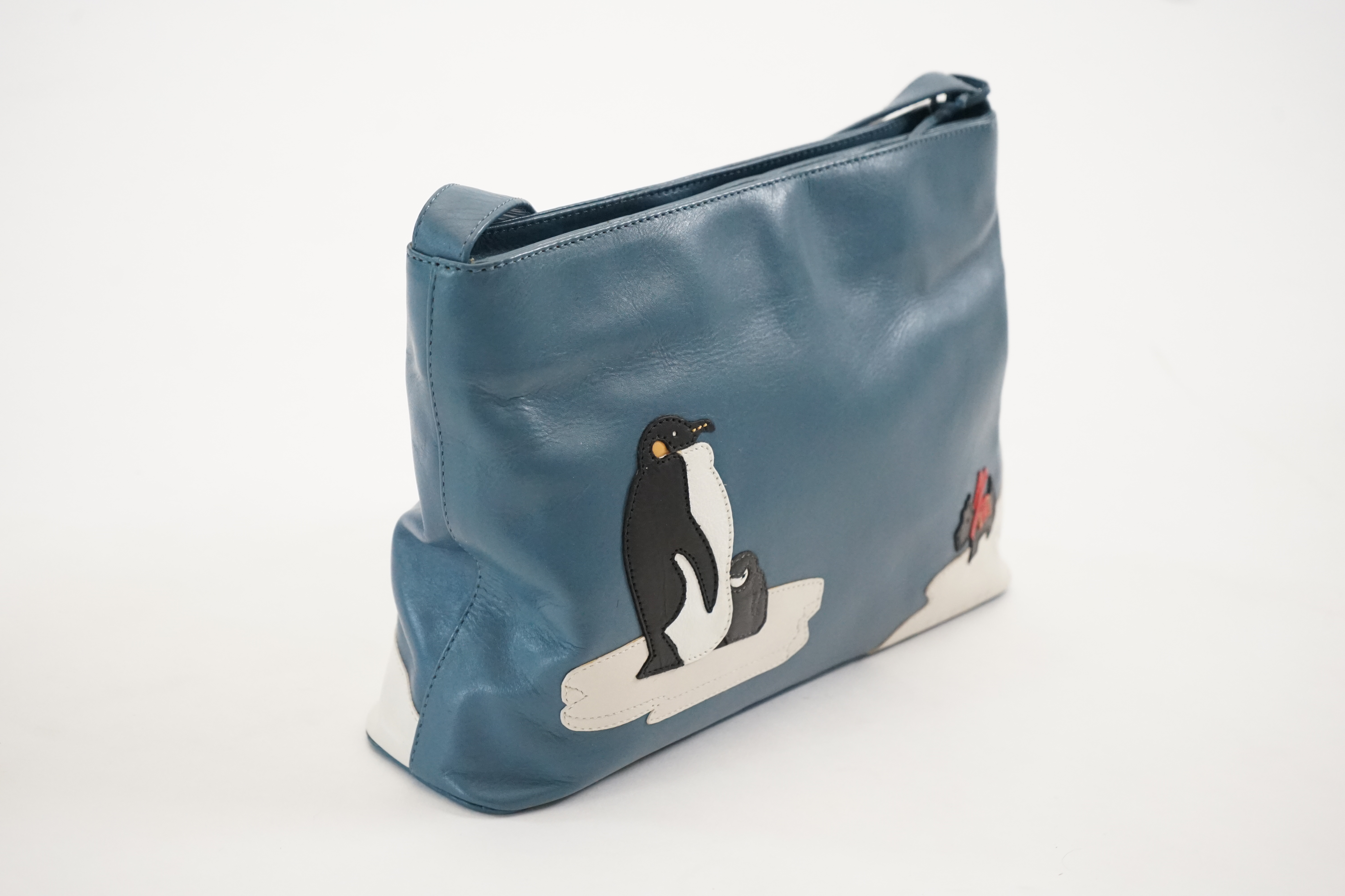 A blue Radley 'Penguins' grab bag 2002, width 29.5cm, depth 8cm, height 19.5cm